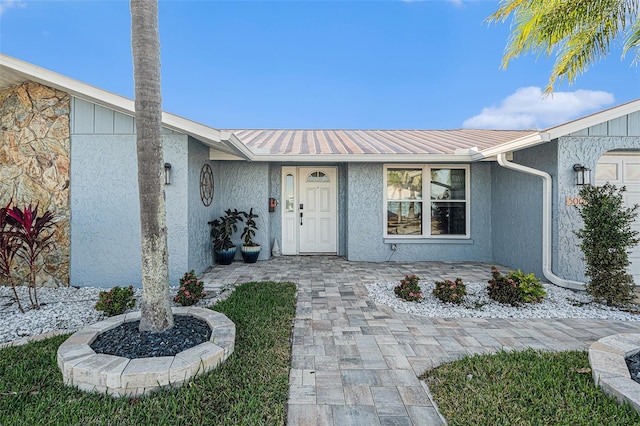 property entrance with a garage