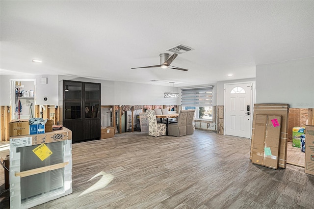 interior space with ceiling fan and hardwood / wood-style flooring