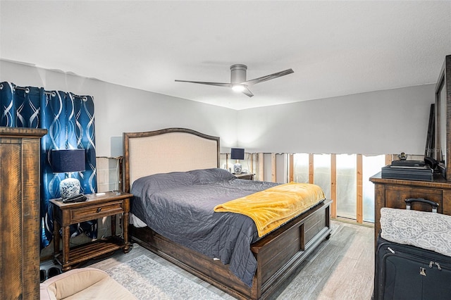 bedroom featuring ceiling fan and wood-type flooring