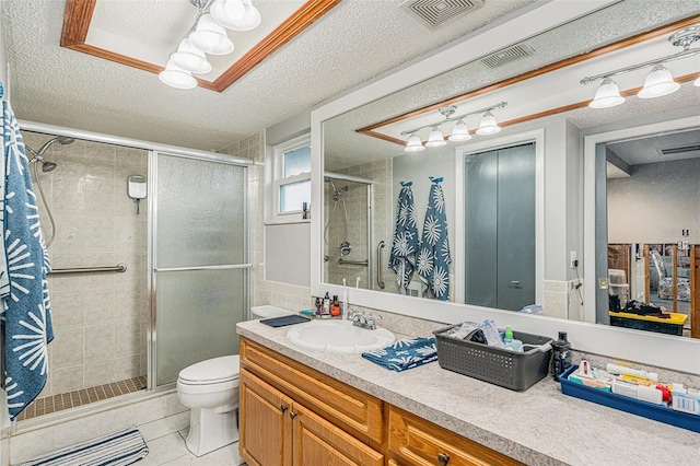 bathroom featuring a textured ceiling, tile patterned flooring, vanity, toilet, and a shower with shower door