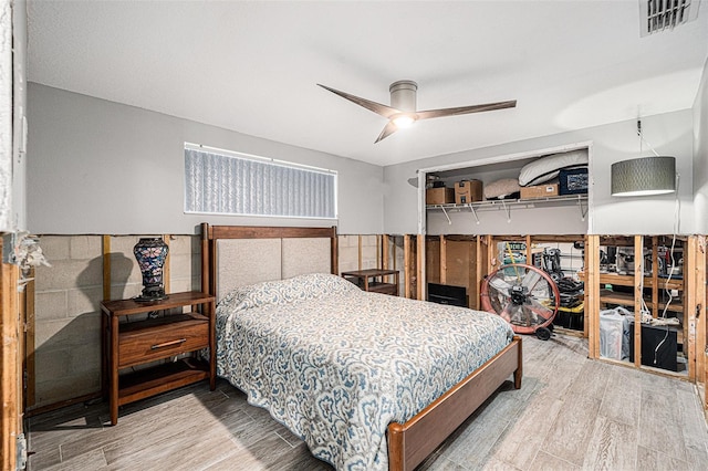 bedroom featuring ceiling fan and wood-type flooring