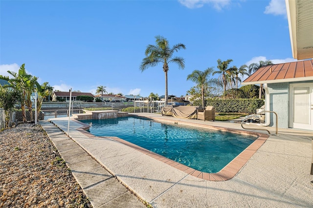 view of swimming pool featuring a patio