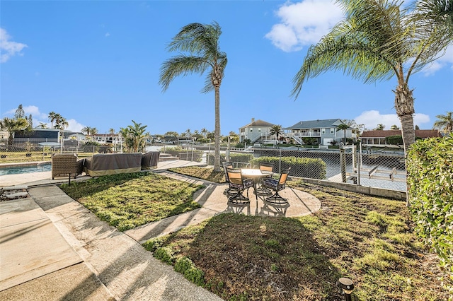 view of yard featuring a patio area and a fenced in pool