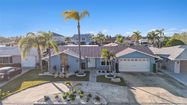 view of front facade with a front yard and a garage