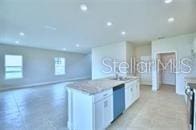 kitchen featuring white cabinets and dishwasher