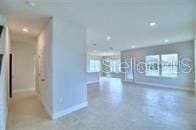 unfurnished living room with plenty of natural light