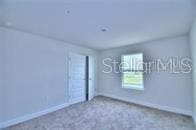 unfurnished room with carpet flooring