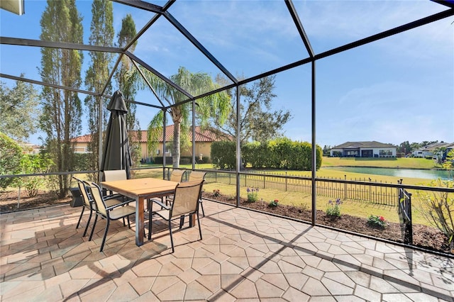 unfurnished sunroom with a water view