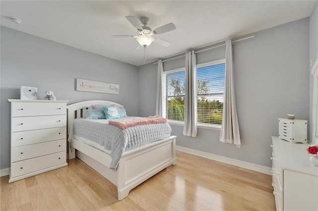 bedroom with ceiling fan and light wood-type flooring