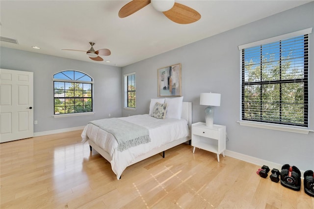 bedroom featuring light hardwood / wood-style flooring and ceiling fan