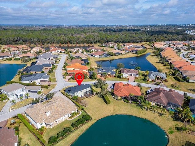 birds eye view of property featuring a water view