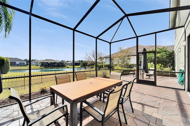 sunroom with a water view