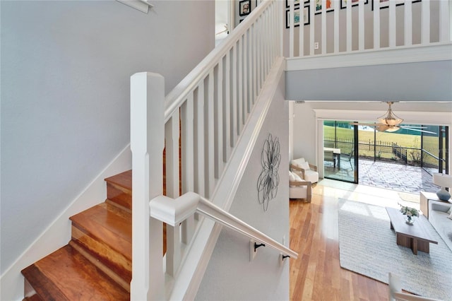 staircase featuring hardwood / wood-style flooring