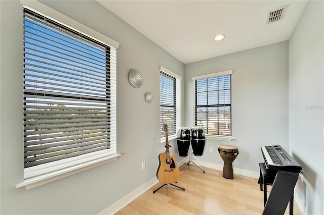 living area with light hardwood / wood-style floors