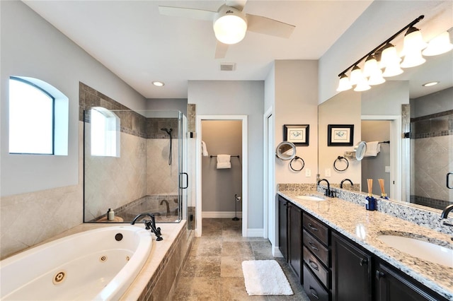 bathroom with vanity and independent shower and bath