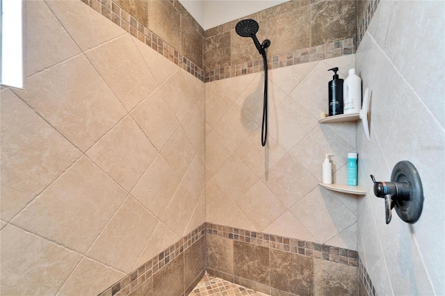 bathroom with a tile shower