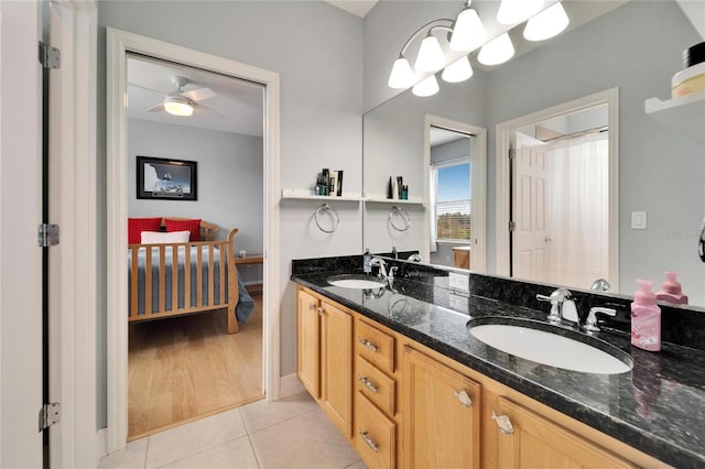 bathroom with ceiling fan, tile patterned floors, and vanity