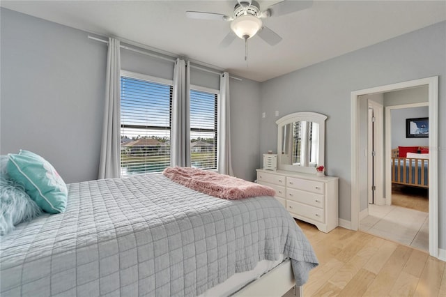 bedroom with ceiling fan and light hardwood / wood-style floors