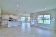 kitchen with a kitchen island and white cabinets