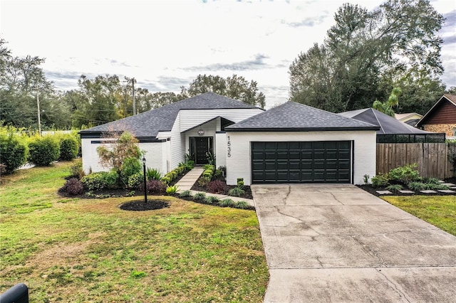 single story home with a front lawn and a garage