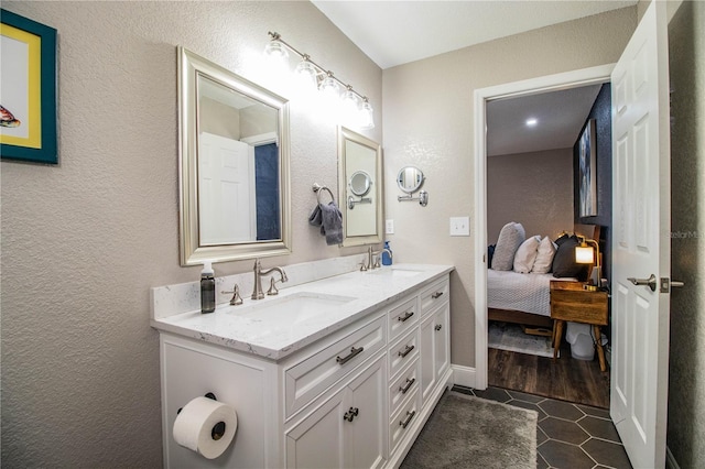 bathroom with tile patterned floors and vanity