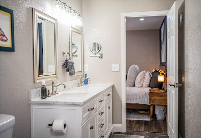 bathroom with toilet and vanity