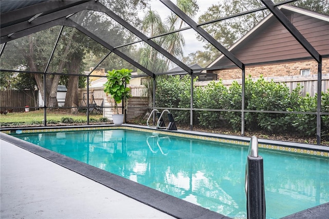 view of pool featuring glass enclosure