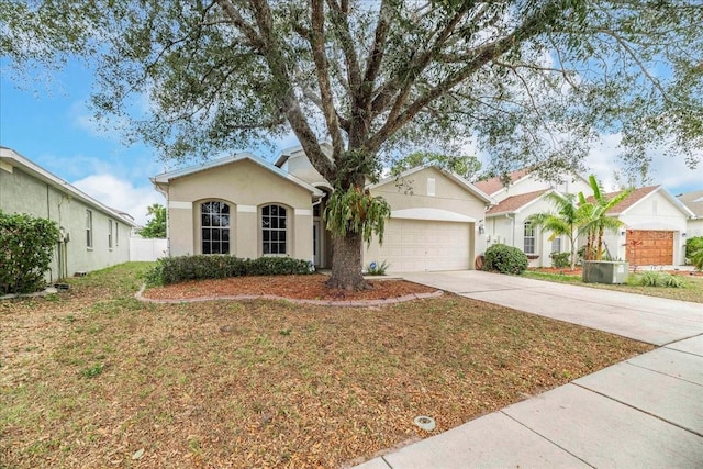 single story home with a garage and a front yard