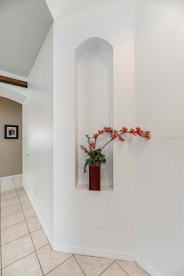 hallway featuring light tile patterned floors