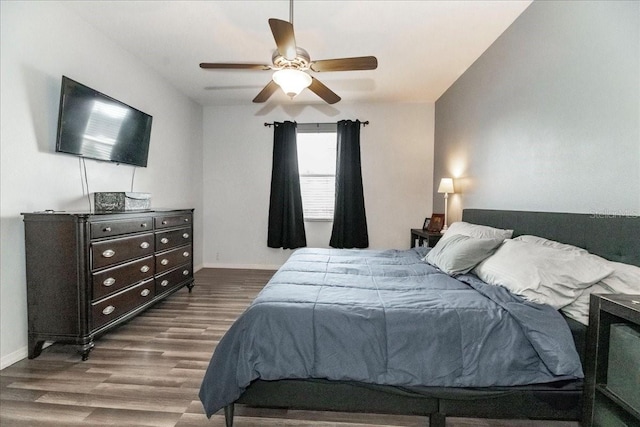 bedroom featuring ceiling fan and wood-type flooring