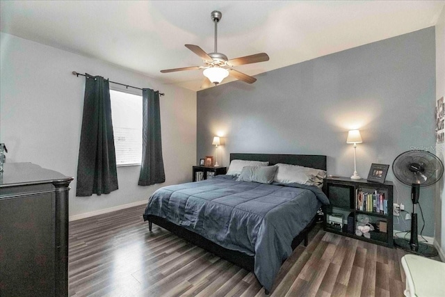 bedroom featuring ceiling fan and dark hardwood / wood-style flooring