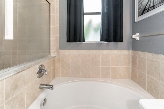 bathroom featuring a washtub