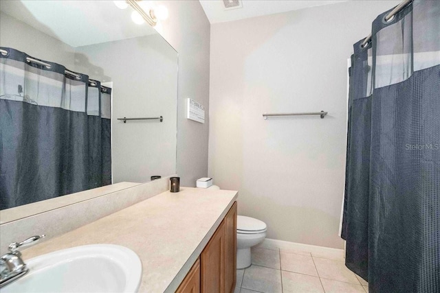 bathroom with toilet, vanity, a shower with shower curtain, and tile patterned flooring