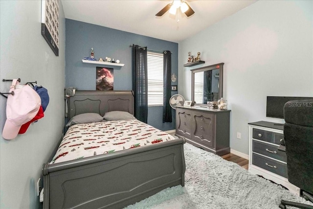 bedroom featuring ceiling fan and hardwood / wood-style floors