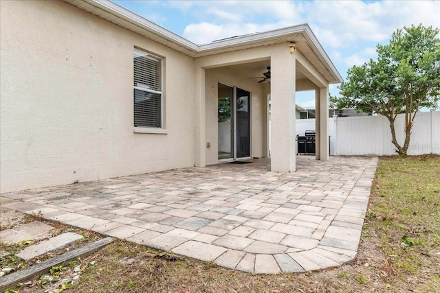 view of patio / terrace with ceiling fan and area for grilling