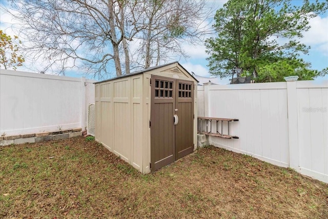 view of outbuilding with a yard