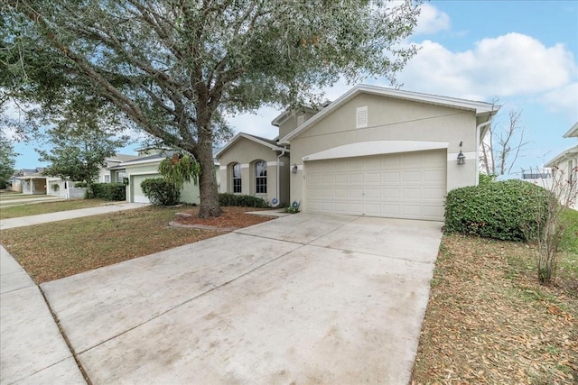 ranch-style house featuring a garage