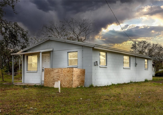 642 Peterson St, Wauchula, FL 33873 - back house at dusk with a lawn