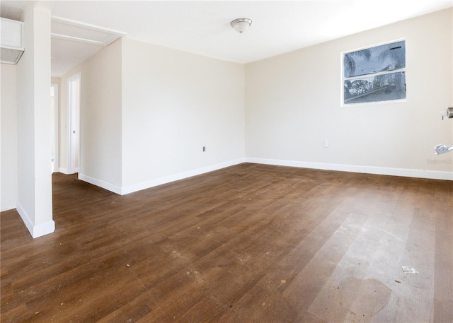 unfurnished room with dark hardwood / wood-style floors