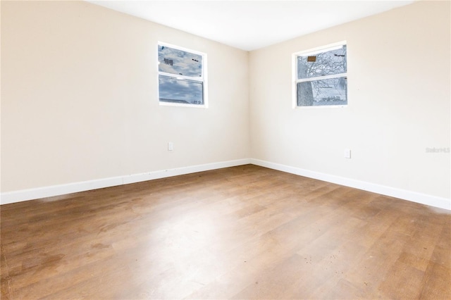 unfurnished room featuring hardwood / wood-style floors