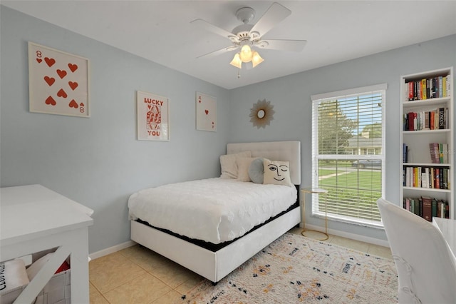 bedroom featuring light tile patterned flooring and ceiling fan