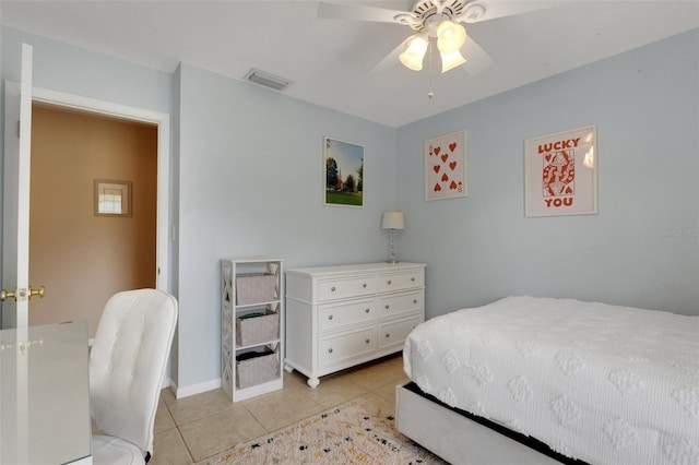 bedroom with ceiling fan and light tile patterned floors