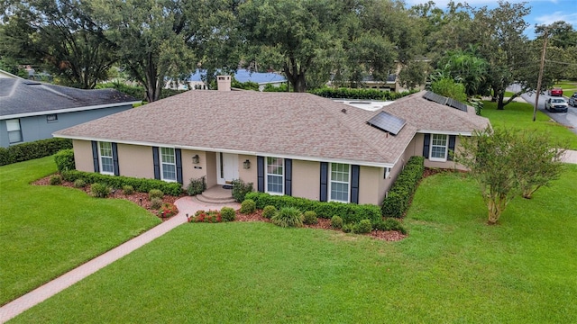 ranch-style house featuring a front yard