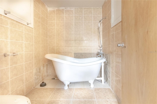 bathroom with tile walls and a bathing tub