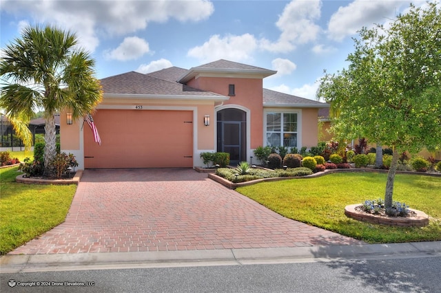 view of front facade featuring a front lawn and a garage