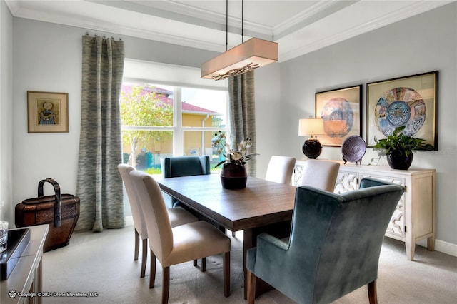 dining area with light colored carpet and ornamental molding