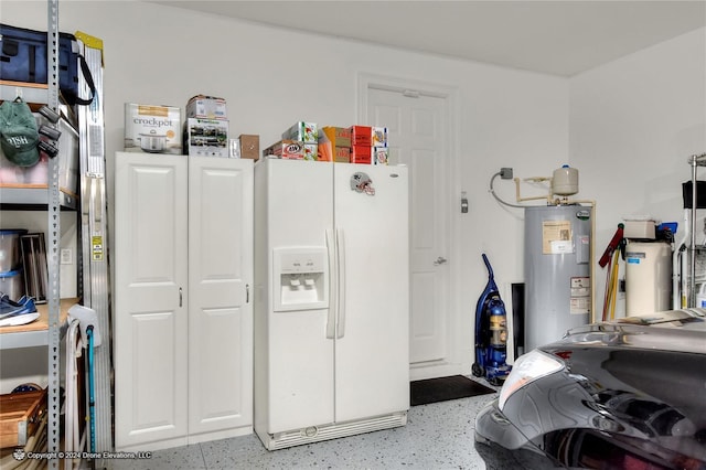 garage with water heater and white refrigerator with ice dispenser