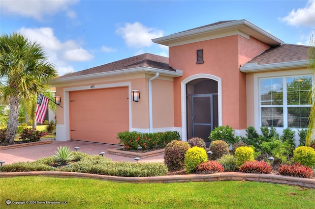 view of front of property with a garage