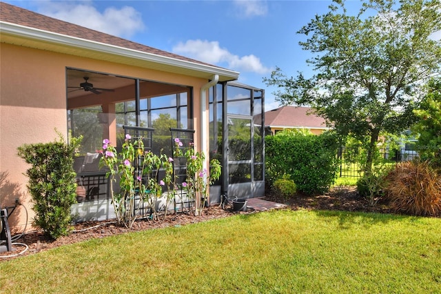 view of yard with ceiling fan