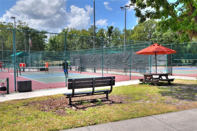 surrounding community featuring tennis court